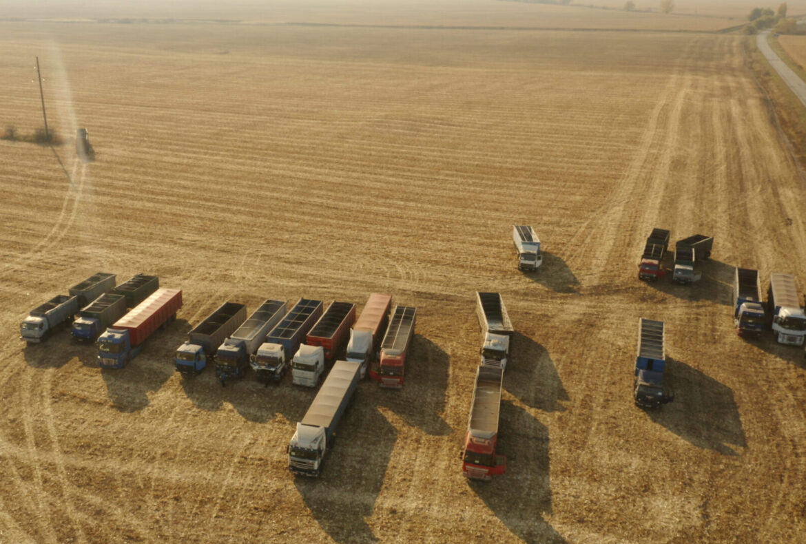 Top view of grain trucks on the field.
